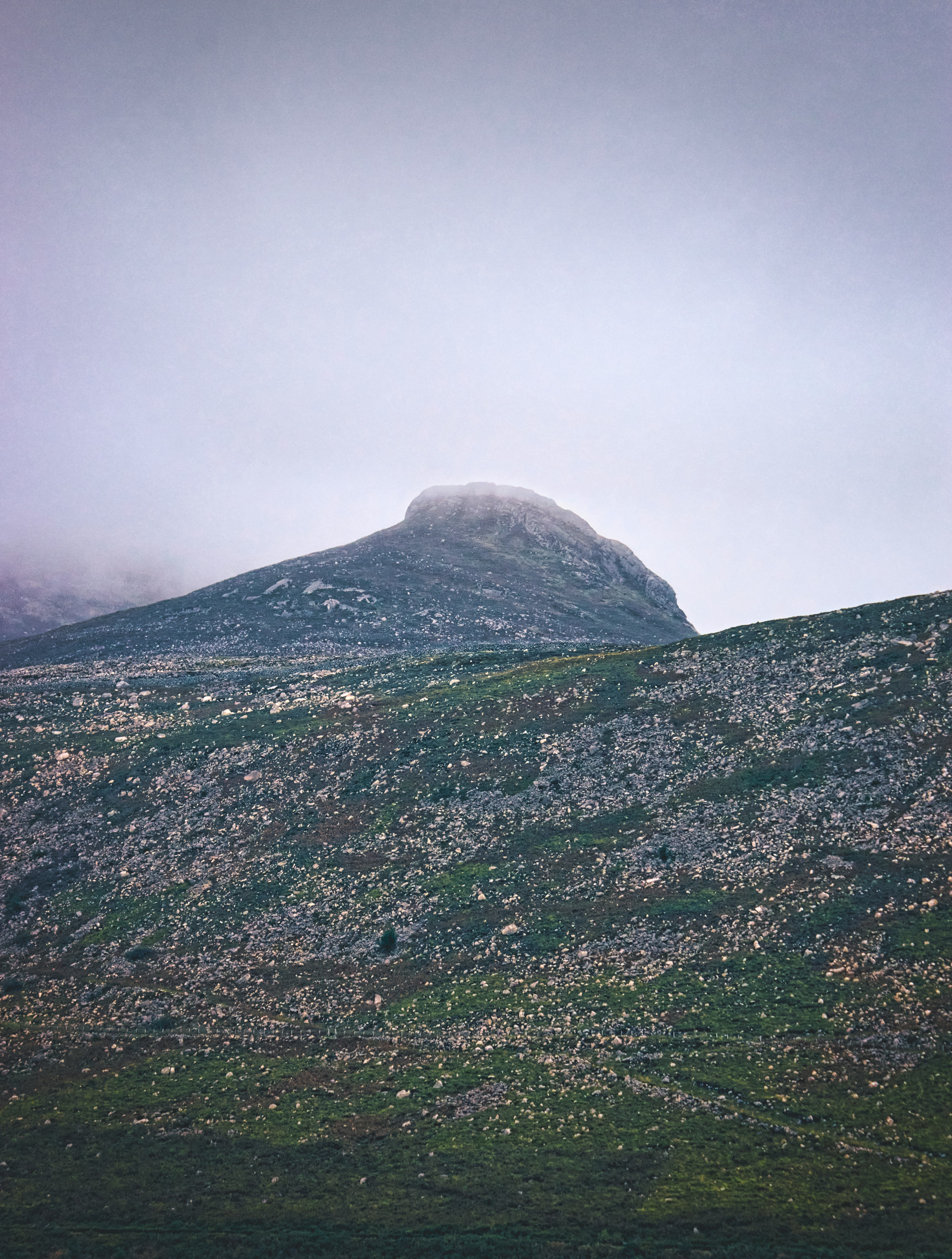 green and white mountain under white sky during daytime